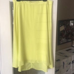 Knee length light lime green silky skirt size 12 Tall